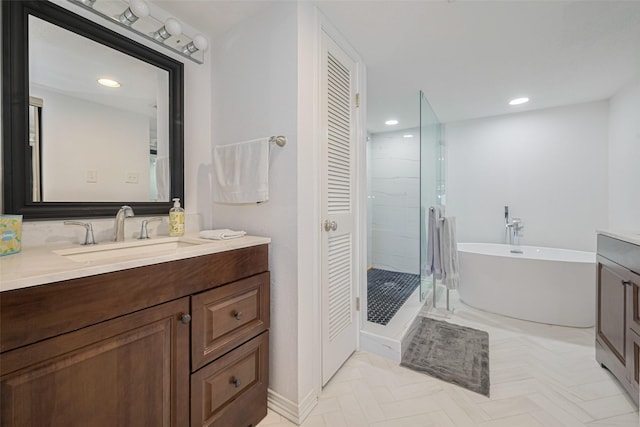 3663 Nasa Pkwy Unit 601, Seabrook, TX 77586 - full bath with a stall shower, vanity, a freestanding bath, recessed lighting, and a closet