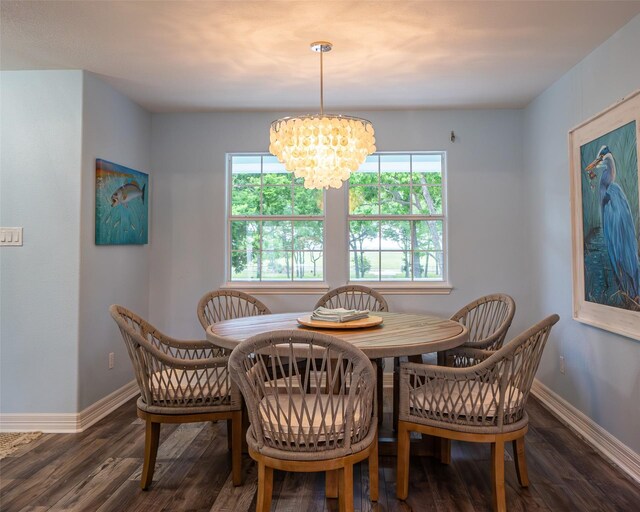 383 County Road 296, Sargent, TX 77414 - dining area featuring healthy amount of natural light, baseboards, and a chandelier