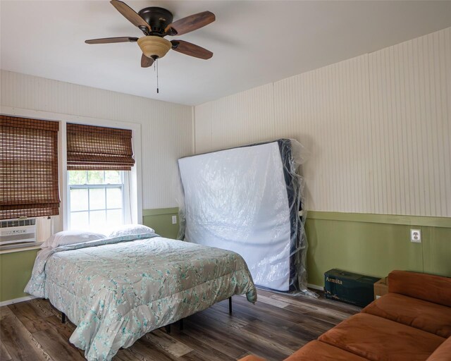 383 County Road 296, Sargent, TX 77414 - bedroom featuring wood finished floors, a ceiling fan, and cooling unit