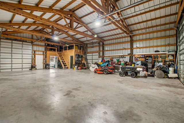 383 County Road 296, Sargent, TX 77414 - garage featuring metal wall and a workshop area