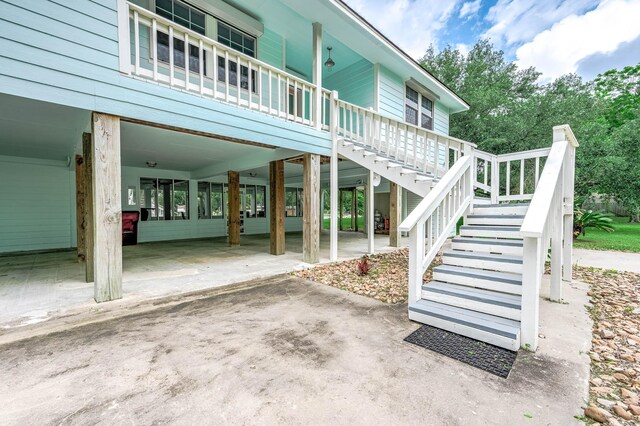383 County Road 296, Sargent, TX 77414 - doorway to property featuring a carport