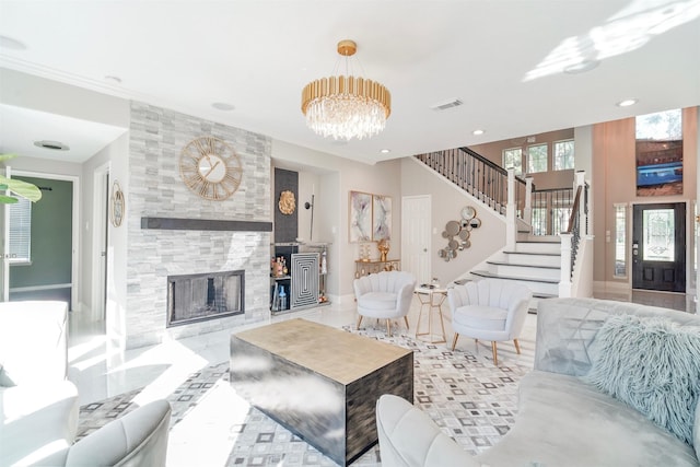 5515 E Terrace Gable Cir, Katy, TX 77494 - living room featuring stairway, a chandelier, a tiled fireplace, tile patterned flooring, and recessed lighting