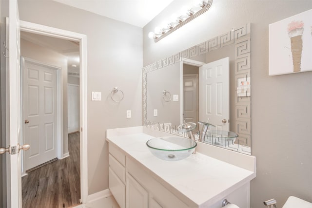 5515 E Terrace Gable Cir, Katy, TX 77494 - bathroom with vanity, wood finished floors, and baseboards