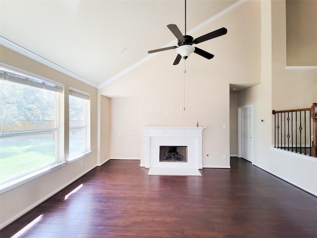 unfurnished living room with high vaulted ceiling, ceiling fan, dark wood-type flooring, a fireplace with flush hearth, and crown molding
