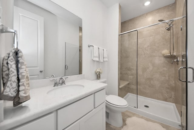17355 Camillia Trl, Conroe, TX 77302 - bathroom with a shower stall, toilet, vanity, and recessed lighting