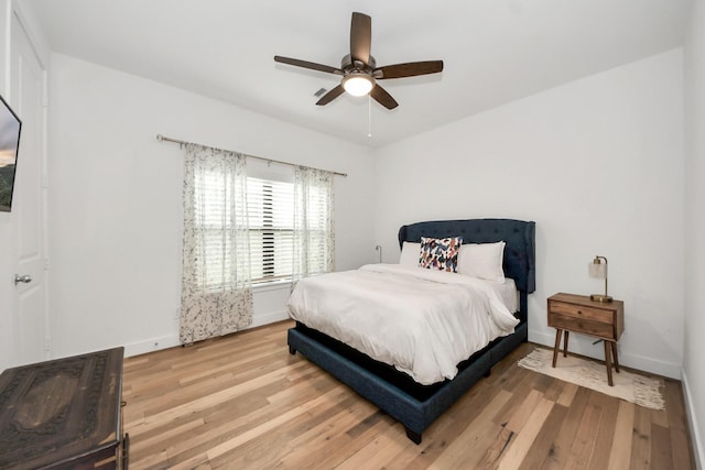 17355 Camillia Trl, Conroe, TX 77302 - bedroom with light wood-style flooring, baseboards, and ceiling fan