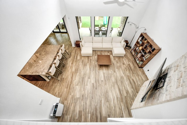 17355 Camillia Trl, Conroe, TX 77302 - living area featuring ceiling fan and wood finished floors