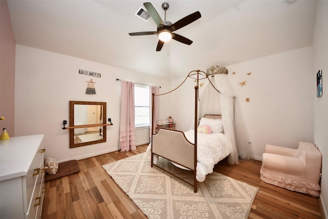17355 Camillia Trl, Conroe, TX 77302 - bedroom featuring light wood-style flooring, lofted ceiling, ceiling fan, and baseboards