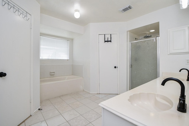 16023 Mission Glen Dr, Houston, TX 77083 - bathroom with a stall shower, vanity, tile patterned flooring, and a garden tub