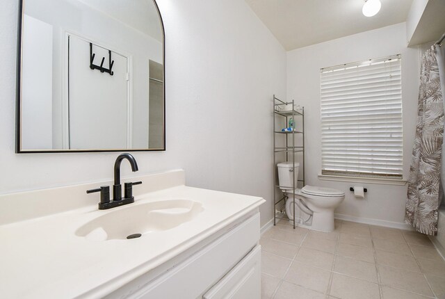 16023 Mission Glen Dr, Houston, TX 77083 - bathroom with tile patterned flooring, baseboards, toilet, vanity, and a shower with curtain
