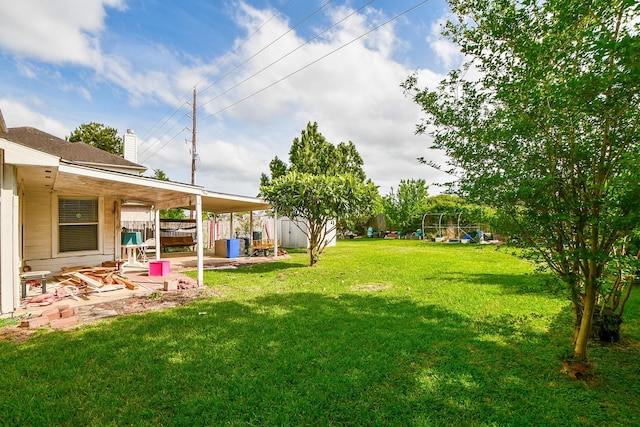 16023 Mission Glen Dr, Houston, TX 77083 - view of yard featuring a patio, a playground, a storage shed, and an outdoor structure