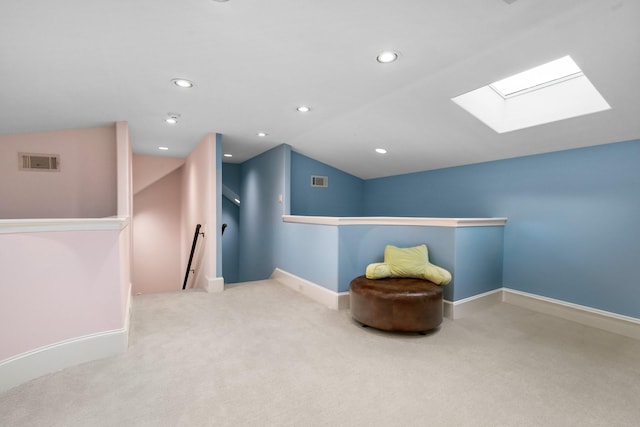 50 Silver Iris Way, The Woodlands, TX 77382 - living area with an upstairs landing, a skylight, lofted ceiling, carpet floors, and baseboards
