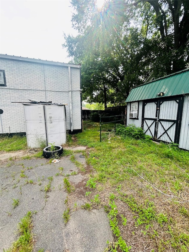 702 Farquhar St, Navasota, TX 77868 - view of yard featuring an outbuilding and fence