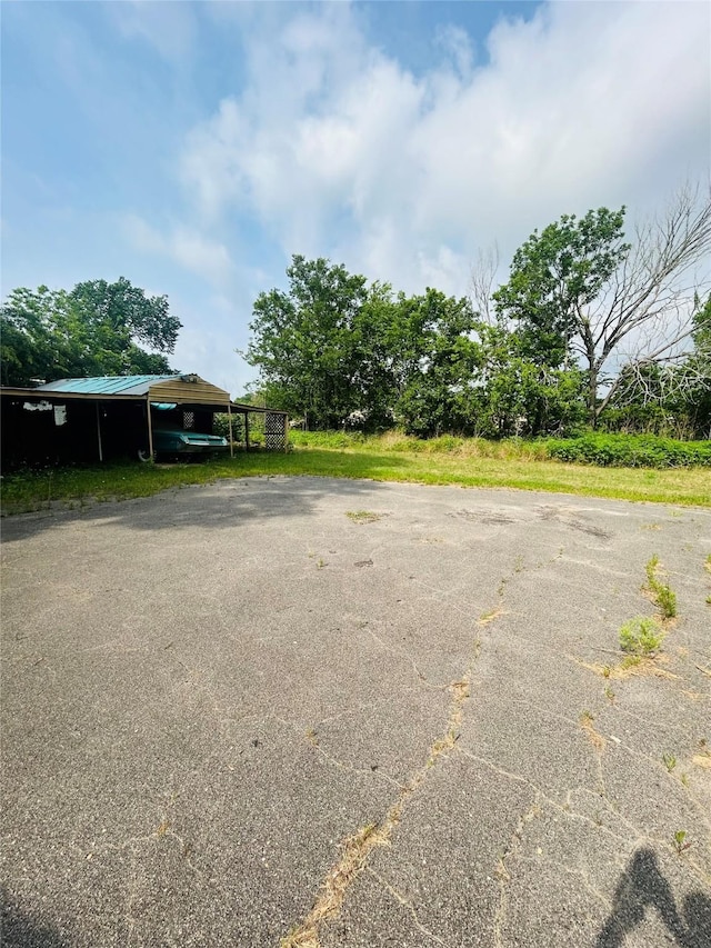 702 Farquhar St, Navasota, TX 77868 - view of car parking featuring a carport