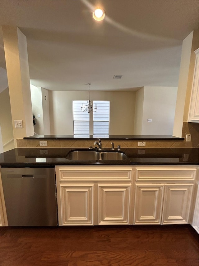 2333 Ann St, Houston, TX 77003 - kitchen featuring dishwasher, a sink, a chandelier, cream cabinetry, and hanging light fixtures