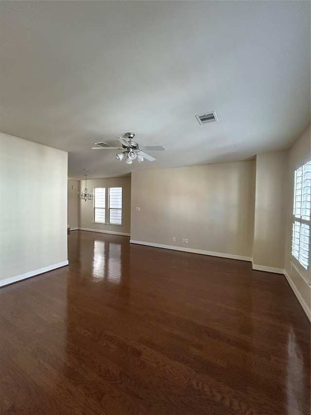 2333 Ann St, Houston, TX 77003 - spare room with dark wood finished floors, baseboards, and ceiling fan