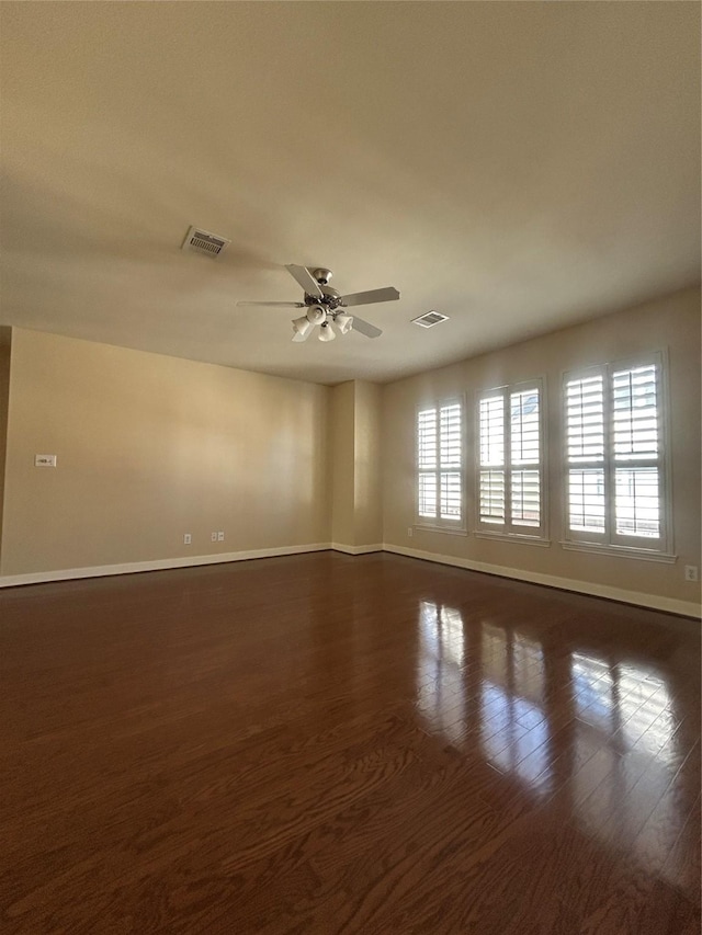 2333 Ann St, Houston, TX 77003 - empty room featuring baseboards, dark wood-type flooring, and ceiling fan