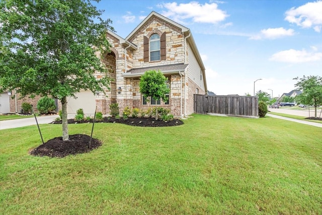 1915 Hays Ranch Dr, Richmond, TX 77469 - view of front of house featuring stone siding, concrete driveway, and brick siding