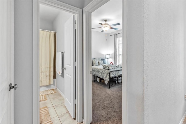 1915 Hays Ranch Dr, Richmond, TX 77469 - hallway featuring light tile patterned floors and baseboards