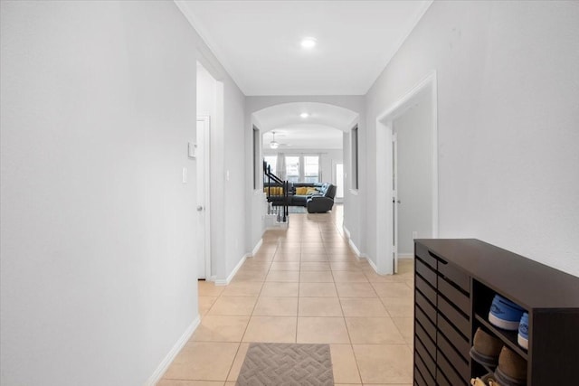 1915 Hays Ranch Dr, Richmond, TX 77469 - hall featuring arched walkways, light tile patterned flooring, and baseboards