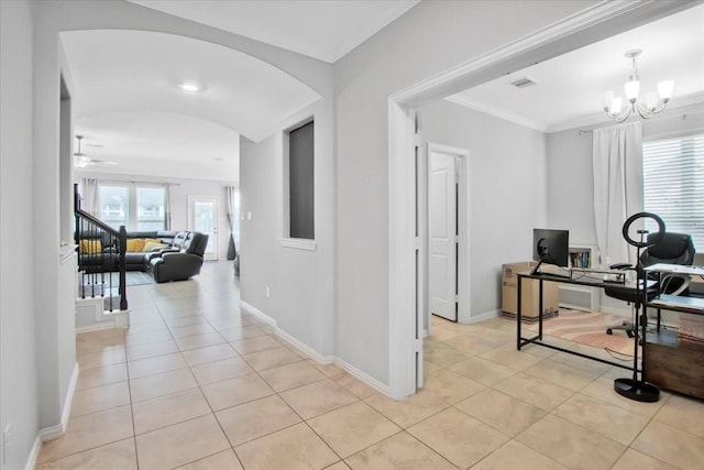 1915 Hays Ranch Dr, Richmond, TX 77469 - hall featuring light tile patterned flooring, a desk, arched walkways, a chandelier, and ornamental molding