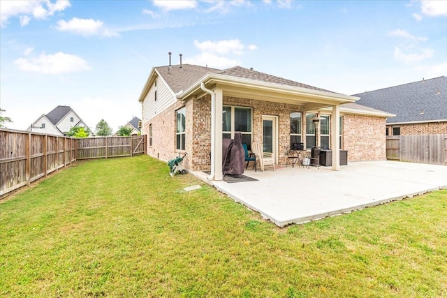 1915 Hays Ranch Dr, Richmond, TX 77469 - back of property featuring a patio area and brick siding