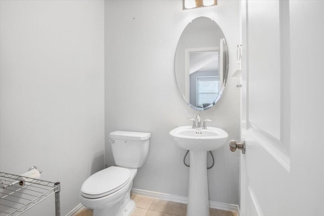 1915 Hays Ranch Dr, Richmond, TX 77469 - bathroom featuring toilet, baseboards, tile patterned floors, and a sink