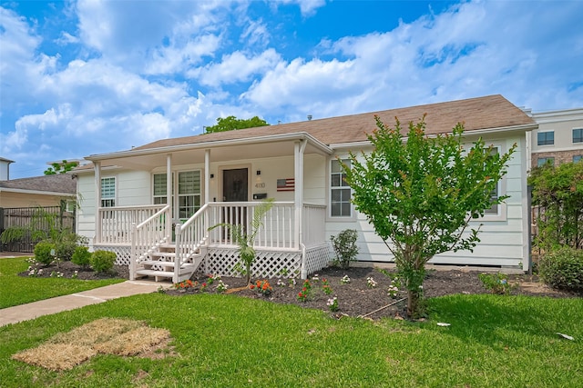 4110 Gramercy St, Houston, TX 77025 - ranch-style house featuring a porch and a front yard