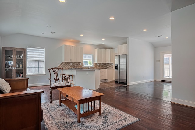 4110 Gramercy St, Houston, TX 77025 - living area featuring lofted ceiling, baseboards, dark wood-type flooring, and recessed lighting