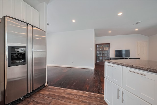 4110 Gramercy St, Houston, TX 77025 - kitchen featuring stainless steel refrigerator with ice dispenser, dark wood-style flooring, open floor plan, white cabinets, and recessed lighting