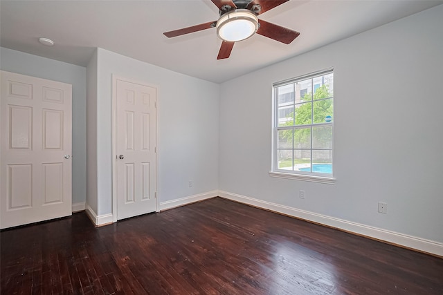 4110 Gramercy St, Houston, TX 77025 - unfurnished bedroom with dark wood-type flooring, baseboards, and a ceiling fan