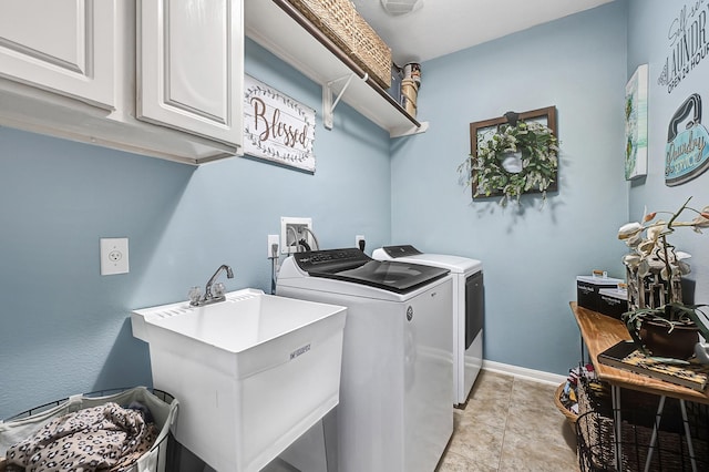 1704 Spring Gln, Pearland, TX 77581 - laundry room featuring cabinet space, washer and clothes dryer, baseboards, and light tile patterned floors