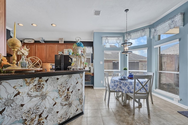 1704 Spring Gln, Pearland, TX 77581 - dining room featuring a chandelier, ornamental molding, recessed lighting, light tile patterned flooring, and baseboards