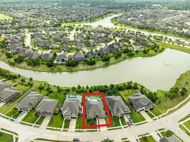 2003 Highland Meadows Dr, Pearland, TX 77089 - aerial overview of property's location with nearby suburban area, a large body of water, and property boundaries highlighted