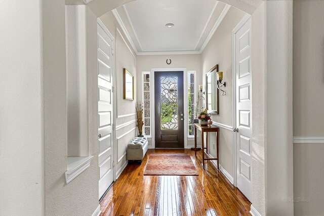2003 Highland Meadows Dr, Pearland, TX 77089 - entrance foyer with arched walkways, wood-type flooring, ornamental molding, and baseboards