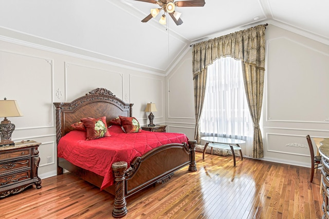 2003 Highland Meadows Dr, Pearland, TX 77089 - bedroom featuring a decorative wall, lofted ceiling, hardwood / wood-style floors, and ceiling fan