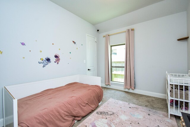 1907 Creekwood Cv, Missouri City, TX 77459 - carpeted bedroom with vaulted ceiling and baseboards
