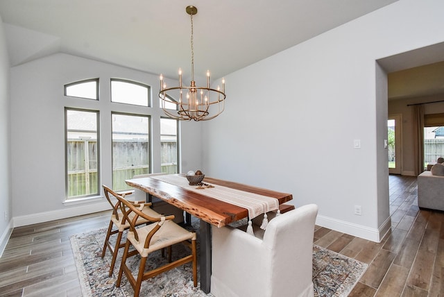 1907 Creekwood Cv, Missouri City, TX 77459 - dining space with a chandelier, baseboards, and wood finished floors