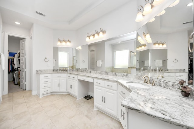 6510 Kangaroo Point Ln, Sugar Land, TX 77479 - full bathroom with a raised ceiling, a spacious closet, recessed lighting, vanity, and tile patterned floors