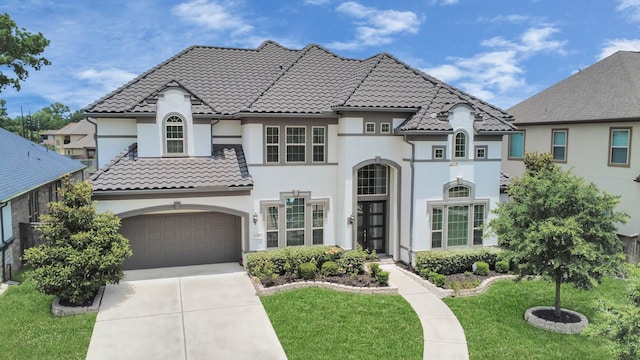 6510 Kangaroo Point Ln, Sugar Land, TX 77479 - view of front facade with stucco siding, driveway, a front lawn, and a tiled roof