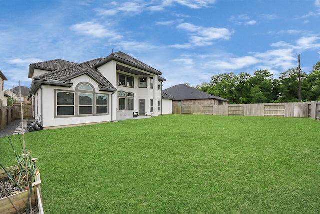 6510 Kangaroo Point Ln, Sugar Land, TX 77479 - rear view of property with a tiled roof and stucco siding