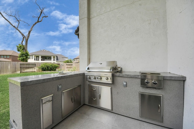 6510 Kangaroo Point Ln, Sugar Land, TX 77479 - view of patio with grilling area, fence, a sink, and area for grilling