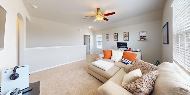 24803 Signorelli Way, Katy, TX 77493 - carpeted living room featuring ceiling fan, baseboards, lofted ceiling, and arched walkways
