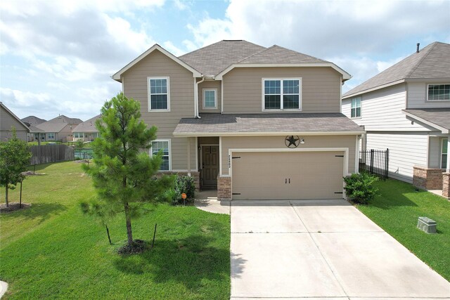 24803 Signorelli Way, Katy, TX 77493 - view of front of house with a garage, driveway, and a shingled roof