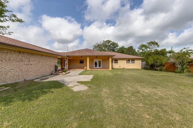 5718 Sheppard Rd, Baytown, TX 77521 - rear view of house with french doors and brick siding