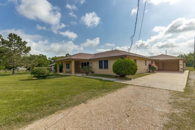5718 Sheppard Rd, Baytown, TX 77521 - single story home with concrete driveway, an attached garage, a front lawn, and brick siding