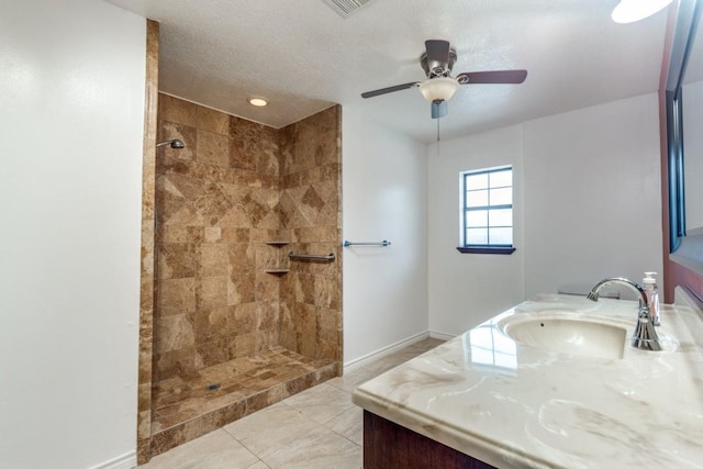 5718 Sheppard Rd, Baytown, TX 77521 - full bath with tiled shower, a ceiling fan, baseboards, and vanity