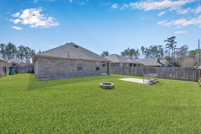 view of yard featuring a patio area and an outdoor fire pit
