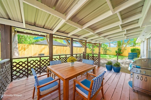 11115 Maple Rock Dr, Humble, TX 77396 - deck with a fenced backyard, outdoor dining area, and grilling area