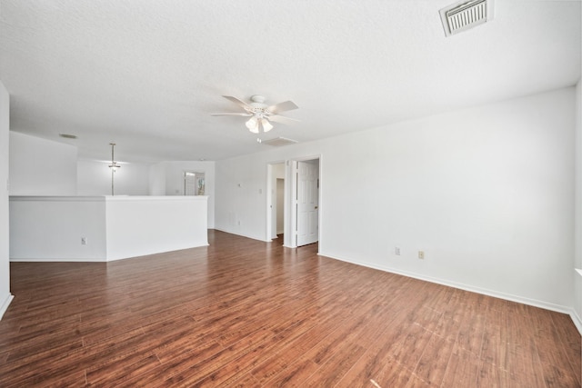 15026 Magnoliabough Pl, Cypress, TX 77429 - unfurnished living room featuring a ceiling fan, wood finished floors, and baseboards